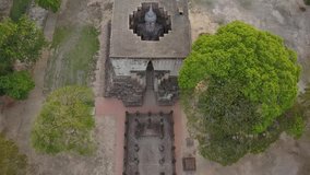 Follow up drone shot: Big buddha in Sukhothai historical park, Thailand. Wat Si Chum is the most important and impressive temple compound in Sukhothai Historical Park.