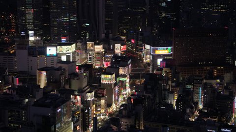 Japan Tokyo Aerial v68 Birdseye view flying low over famous Shinjuku area panning down at night 2/17