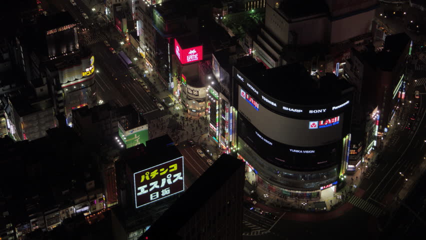 Japan Tokyo Aerial v80 Birdseye view flying low around famous Shinjuku crossing night 2/17