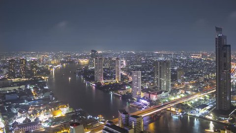 Time Lapse High Above Bangkok and its River at Night