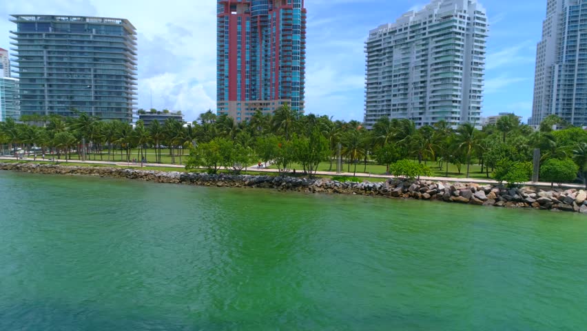 Miami Beach South Pointe Park shore rocks palm trees 4k 60p