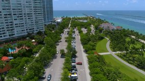 Aerial footage Miami Beach South Pointe Park parking lot and beach access 4k 60p