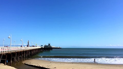 SANTA CRUZ, CA, USA - 30 APRIL 2017: Santa Cruz Wharf at Covells Beach, Santa Cruz, California in 2017. With a length of 2,745 feet (836.68 m), it is the longest pier on the West Coast of the US.