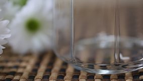 Pouring rice into glass jar closeup macro blur background