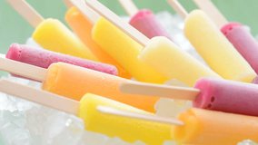Assorted Frozen Fruits  Juice Lolly on Ice, Rotate 