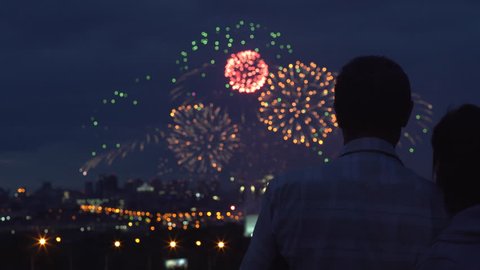 4k Romantic old Couple Silhouette Watching Fireworks Hugging Love Relationship Celebration Concept