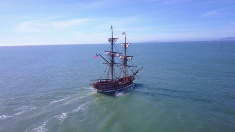 Ventura, California-2010s: Spectacular aerial following a tall sailing ship on the open ocean by day.