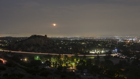 Los Angeles moonrise dusk to night time lapse behind Stoney Point Park in the San Fernando Valley area of Southern California.