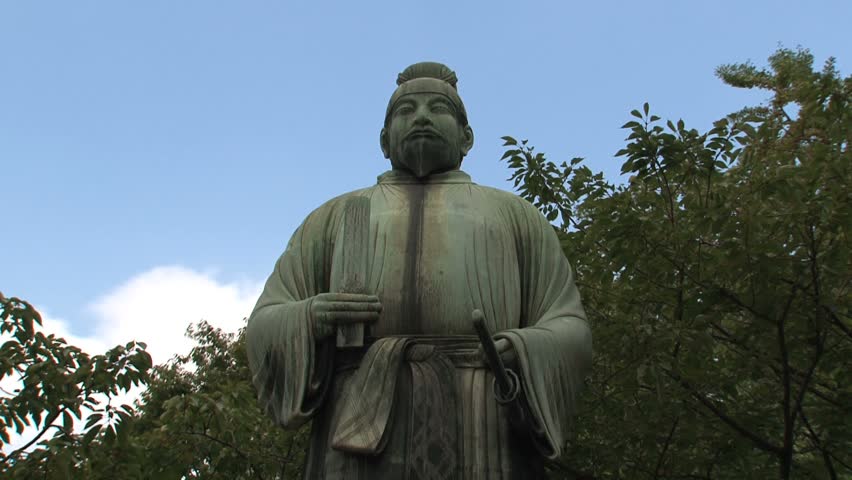 TOKYO - CIRCA 2012: Statue of Wake no Kiyomaro outside of Tokyo Imperial Palace is the main residence of the Emperor of Japan. It is a large park-like area located in the Chiyoda area of Tokyo.