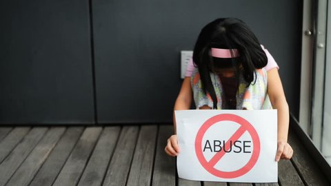 Young girl show child abuse sign.
