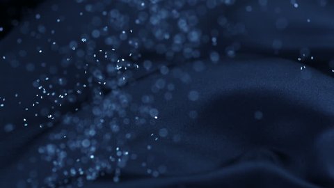 Blue silk fabric flowing with with glitter shooting with high speed camera, phantom flex.