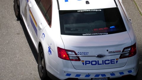 Coquitlam, BC, Canada - June 30, 2017 : Top shot of red and blue emergency lights flashing on police car with 4k resolution