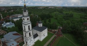 4K aerial video footage view of medieval beautiful Volokolamsk Kremlin with church and cathedral, road and hilly area around it in Mozhaisk near Moscow, capital of Russia in sunny summer morning