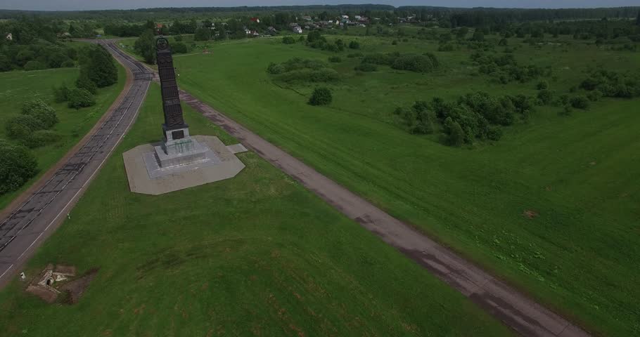 4K aerial video footage view of old beautiful 1812 war military memorial, Spaso-Borodinski monastery and green fields area around it in Borodino near Moscow, capital of Russia in sunny summer morning
