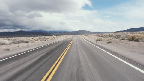 Driving USA: The open road – spectacular roller coaster road through the desert, California, USA