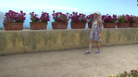 young blonde woman walking in Ravello at Italy