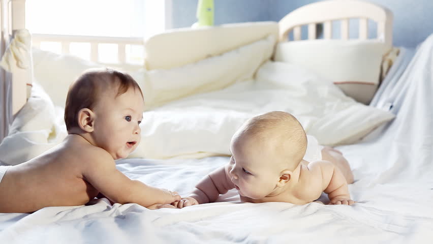 Two babies on the bed