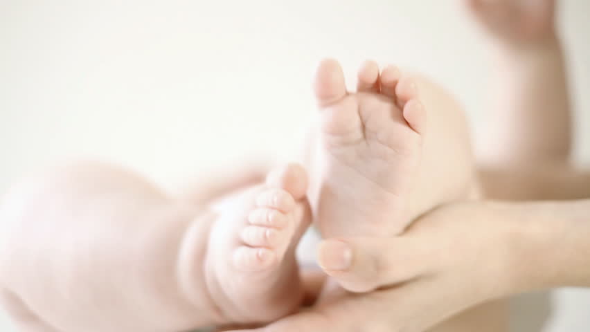 Baby foots on the light background
