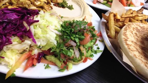 Shawarma, schnitzel, salads, hummus & tahini at an Israeli restaurant