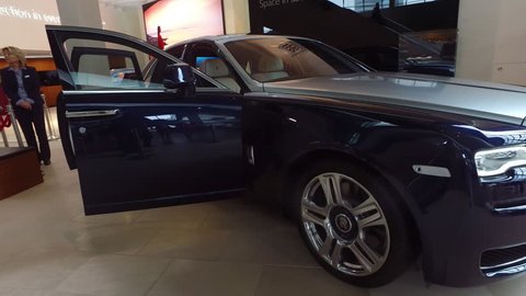 Munich, Germany-2010s: A luxury Rolls Royce car sits in a showroom.