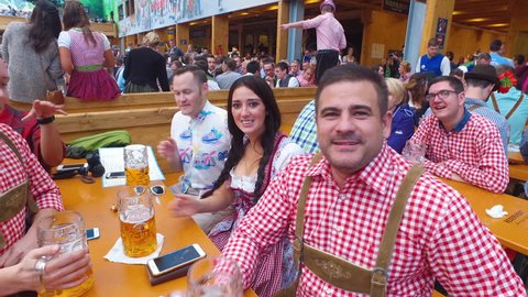Munich, Germany-2010s: People drink, sing and celebrate at Oktoberfest, Germany.