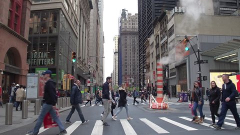 New York, Usa, 05.05.2017. The street of New York. Pedestrian crossings, smoking pipe, skyscrapers in Manhattan. Steadycam shot