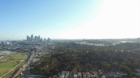 Aerial pedestal down of Los Angeles view behind Radio Hill