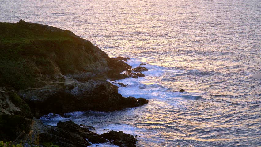 Waves hitting the rocky Coast of Big Sur California