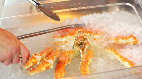 Crab being prepared by chef in kitchen