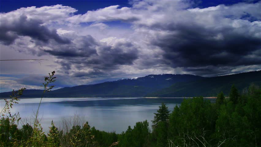 time lapse dark eerie clouds over water