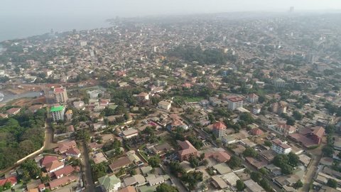 Drone view of the capital Conakry in Guinea, West Africa - city aerial with coast of Atlantic ocean