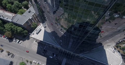 KYIV - Glass skyscraper 2 July 2017. Aerial rising shot of reflective office skyscraper details in a modern business district. Cityscape, skyscraper, building, downtown, business center, outdoor.
