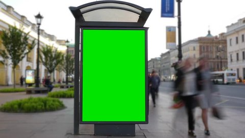 Time Lapse. A Billboard with a Green Screen on a Busy Street