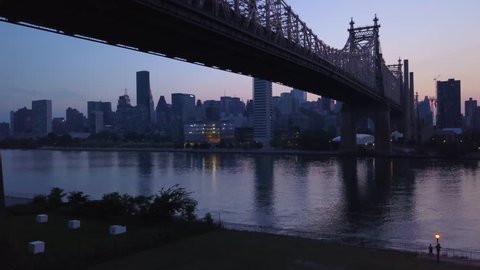 dusk rising over Queensboro Bridge view of Manhattan