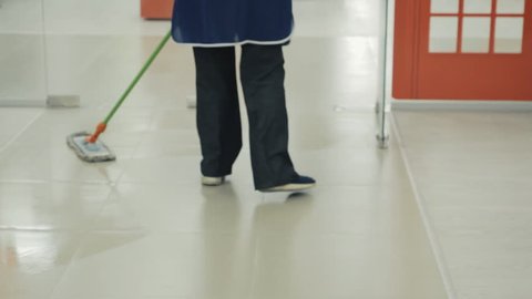 View of Female Foot and Mop at the Office Corridor, Woman Cleaning the Floor