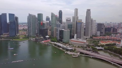 Travelling drone shot of Singapore City Skyline with sky scrapers in the background  - Singapore July 2017