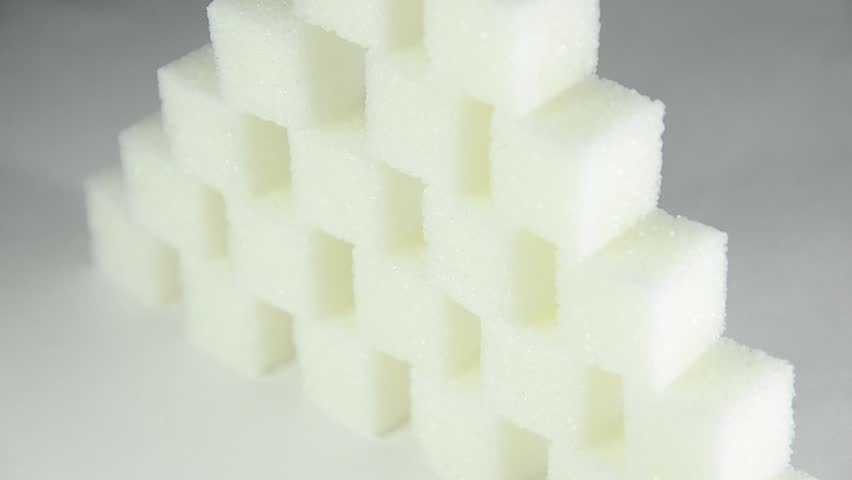 Pyramid of white sugar cubes (rotating)