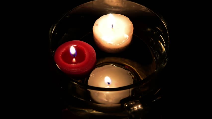 Candles floating in a glass bowl