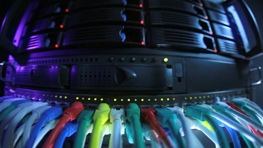 Server Rack and Network Hub cables with flickering lights toned in blue color
