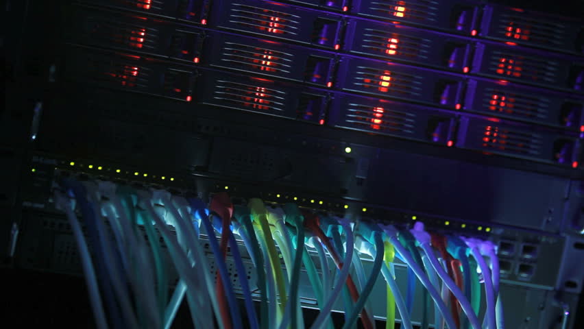 Server Rack and Network Hub cables with flickering lights toned in blue color