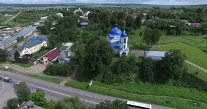 4K aerial video footage view of medieval beautiful 1753 Sretenskaya church, main road and hilly area around it in Pereslavl-Zalesskiy on Golden Ring route 120 km from Moscow, Russia in summer day