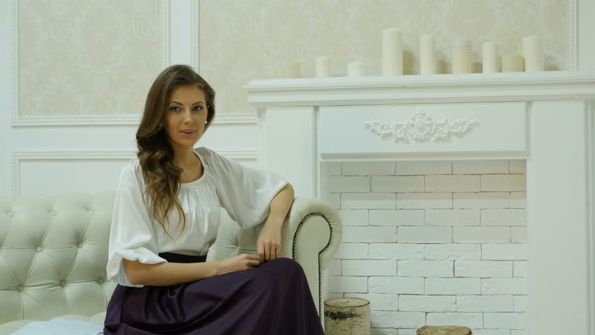 Young beautiful businesswoman in white clothes.