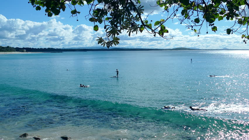 People on stand up paddle boards at Noosa Heads on the Sunshine Coast, Queensland, Australia.
