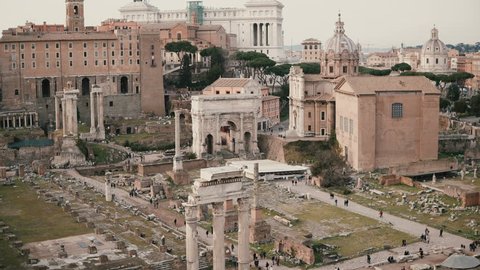 Panorama with marble Arch of Septimius Severus in Rome, Italy. The House of Vestals lies at the foot of Palatine Hill.