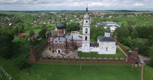 4K aerial video footage view of medieval beautiful Volokolamsk Kremlin with church and cathedral, road and hilly area around it in Mozhaisk near Moscow, capital of Russia in sunny summer morning