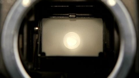 Camera shutter aperture transition in slow motion. Closeup camera lens