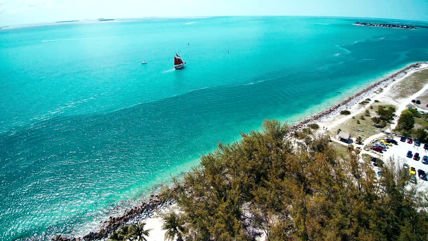 Sailboat on the ocean with happy tourist Key West