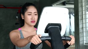  sportswoman building her leg muscles riding a fitness machine