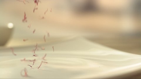 saffron falling in a plate in slow motion