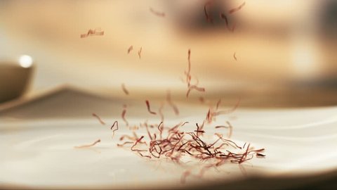 saffron falling in a plate in slow motion